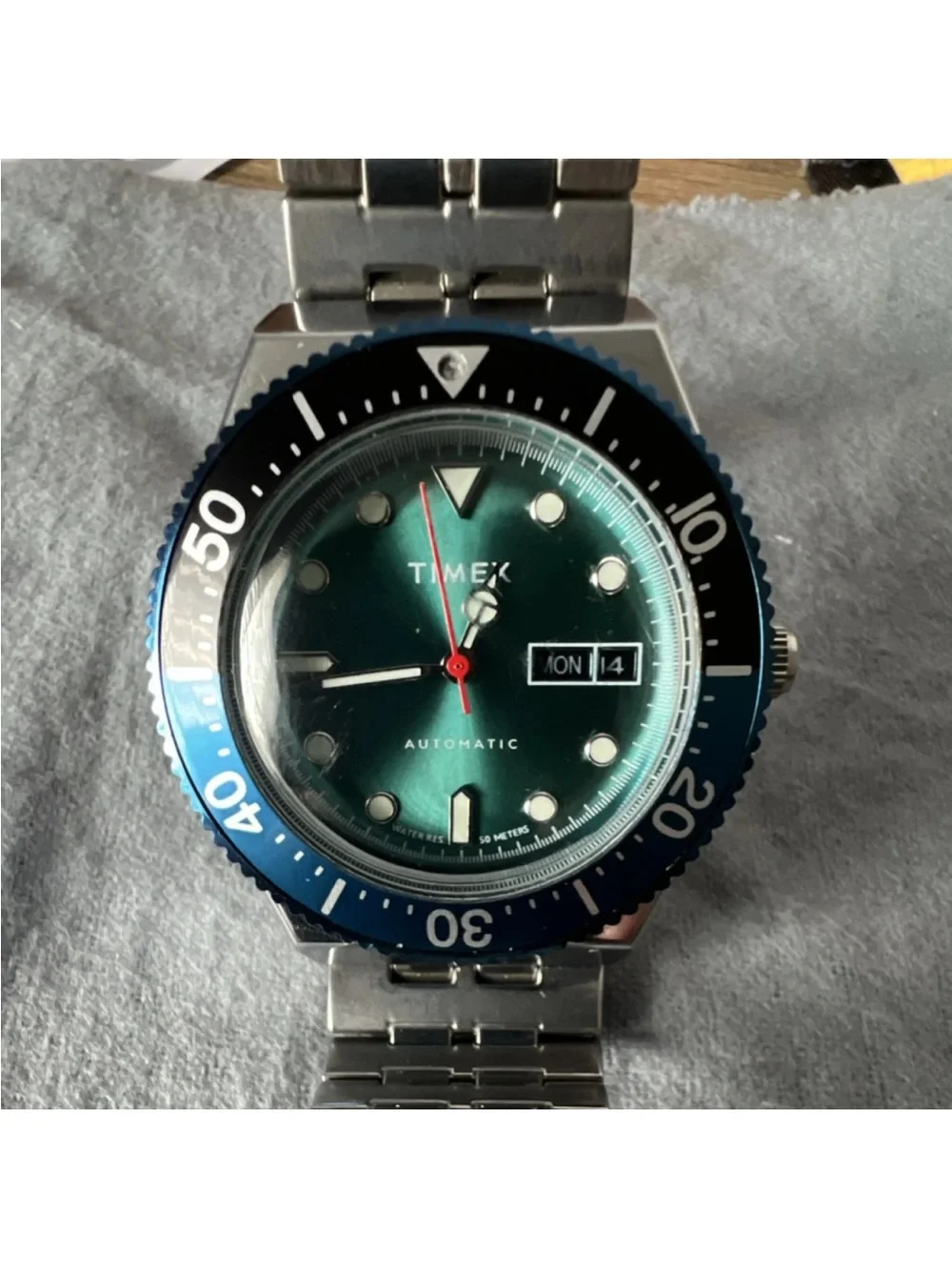 The Timex M79 Automatic.Timex Green Dial with Blue Bezel Stainless Dive Watch